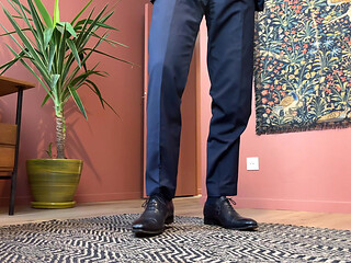 Jerking off at the office in a suit and tie