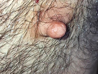 Male nipples in the foreground