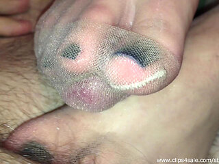 Tan nylons footjob with cock trapped inside