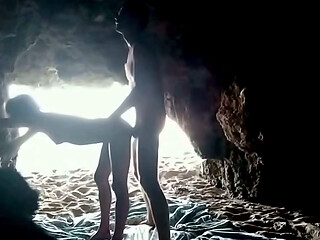 Couple recorded at the beach, inside the cave