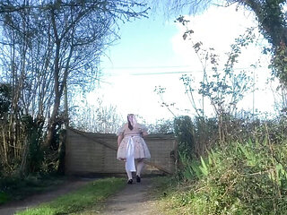 In a babydoll outfit to pee a second time in the diaper outside