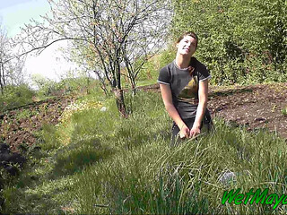 Pissing in grass on the side of the road