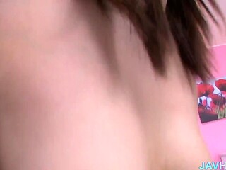 Japanese AV babe shows off her huge tits and Asian booty