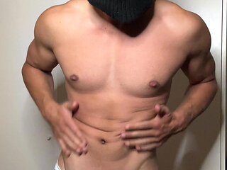 Young hunk strips in thong