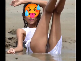 Nude model in a public beach photoshoot. Small tits nice ass