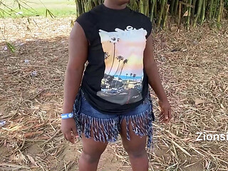Ebony sexy black girl dances in outdoor with much laughter