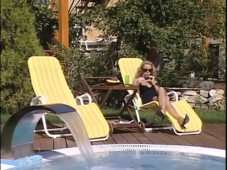 Horny babes lick and suck huge cock in a garden threesome