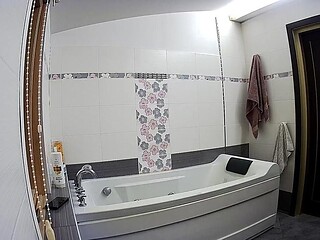 Amateur girlfriend prepares to take a bath in the bathroom