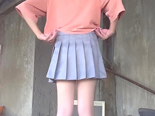 A Pleated Skirt Paired with White Underwear, and an Anal Plug Inserted on the Terrace