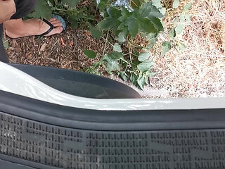 Peeing next to lorry
