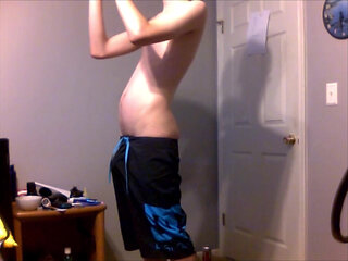 Young Guy Fills His Stomach with Water