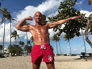 BEACH BODY LIFEGUARD PORNSTAR FLEXING AT THE BEACH