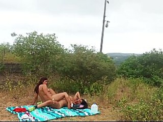 Busty stepmom and curvy stepdaughter enjoy lesbian action in the woods