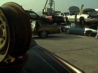 Hot sexual moment in a car demolition...