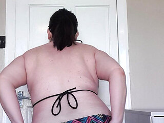 Stripping in my bikini showing off my ass