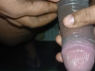 Jerking Off With Condom On Massive Cumshot Filling It Up