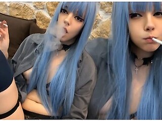 Blue-haired girl smokes in your space with a sultry vibe