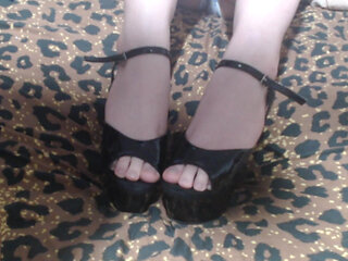 Trying on black high heels