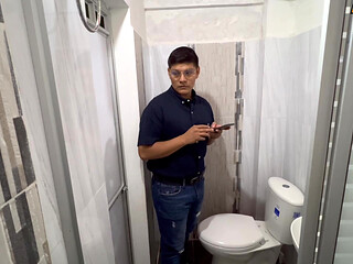 Teacher his student in the bathroom.