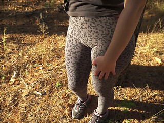 Girl Teases Her Big Cameltoe in Leopard Leggings Outdoors