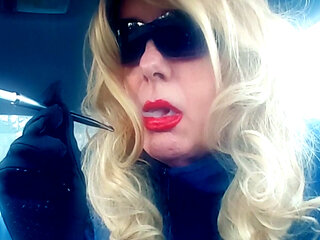 A BLONDE MRS. RUTHIE ROMAN MATURE SMOKING VS120's IN A CIGARETTE HOLDER