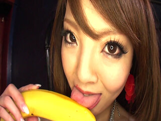 The great Hitomi sucks and tit-fucks a banana then gets all