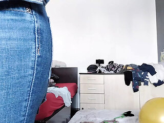 An amateur has fun trying on clothes she has cut. An amateur dances naked in the house.