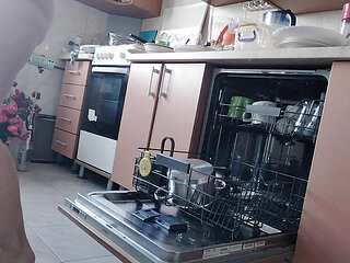 Sexy nude wife preparing food in the kitchen. Hairy brown hair, big ass, big tits.
