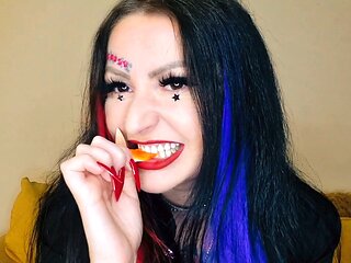 Dominatrix Nika indulges in her food fetish by chewing gummies