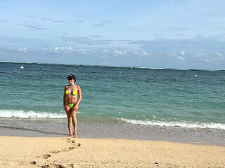 Teasing on the Beach in Micro Bikini on the Sand