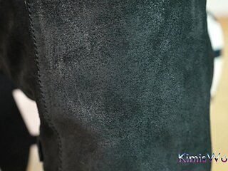 Rugged Elegance - Worn Tights and Biker Boots in a Black Minidress