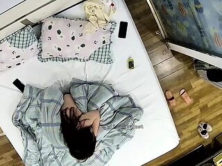 Cute amateur asian web cam girl playing with her toy