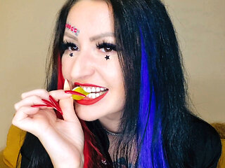 Food fetish. Dominatrix chews gummies. Teeth fetish, chewing fetish