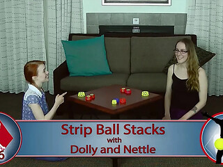 Lesbian lovers compete in a sexy strip game of balls