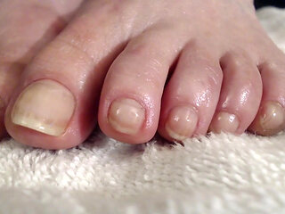 Long natural toenails oiled feet