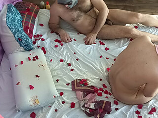 Sensual massage of a hot couple with oil on the body.