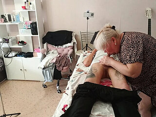 Stepmom gives amazing deep throat blowjob and swallows cum on massage table