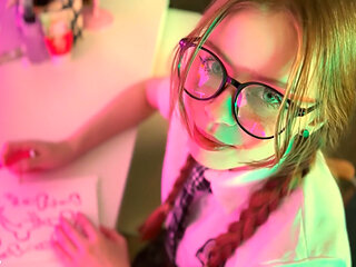 Schoolgirl with glasses drew penises instead of homework and was fucked on the table