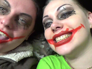 Two crazy clown girls dangle you above their hungry mouths before fighting over who will eat you alive