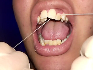 Trying to Use Dental Floss (close-up)