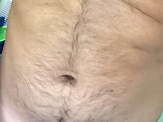 Trimming the fur of the naughty and furry teddy bear