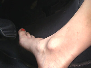 Nyllady with Her Bare Foot on Gas Pedal Driving