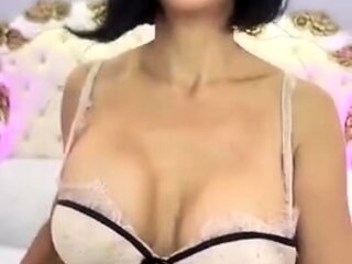 Busty curly brunette with big boobs fucks on couch