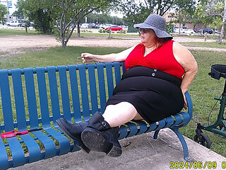 Nurse Vicki Smoking in the Park on a Bench All Dressed up