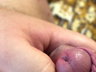 Fat man lying on the couch shows his ass and cums without hands, a lot of cum, cum, uncircumcised penis