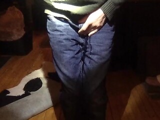 Feeling the warmth of piss spreading in wet jeans