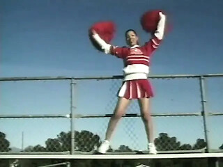 Young cheerleader with honey skin enjoys a wet and wild lesbian session