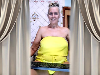 Cheerful Housewife Lukerya Shows Her Bare Feet in Kitchen. Mature Soles and Toes Close Up