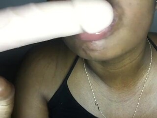 Sexy lips wrap their mouth around a hard cock