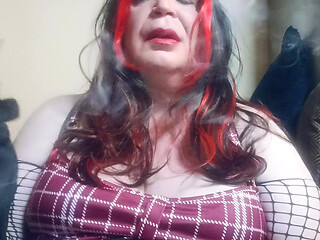 BBW TV talks dirty whilst smoking using a long stemmed cigarette holder